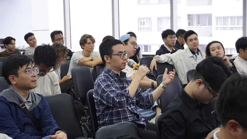 Attendee asking a question about a talk