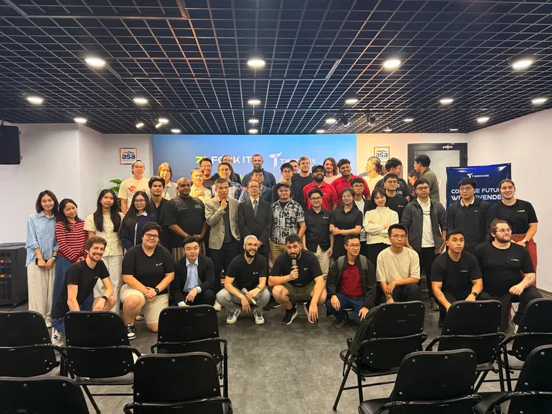 Speakers and attendees gathered for a group photo