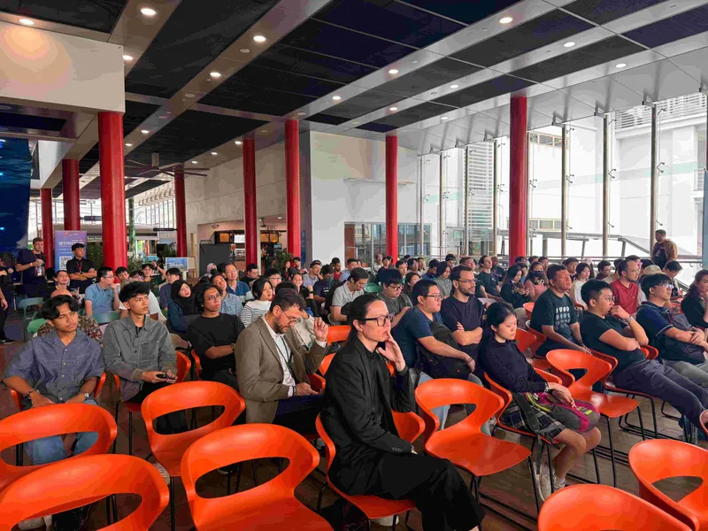 Attendees looking at a talk